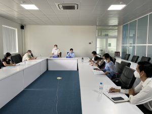 A group of people sitting at a tableDescription automatically generated