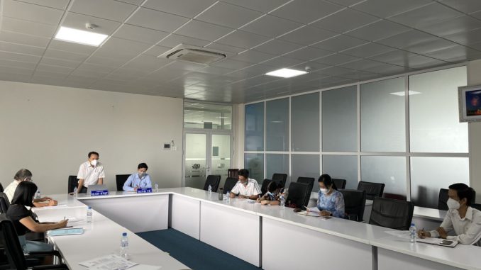 A group of people sitting at a tableDescription automatically generated